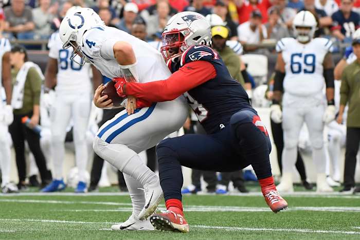 Nov 6, 2022; Foxborough, Massachusetts, USA; New England Patriots linebacker Matthew Judon (9) sacks Indianapolis Colts quarterback Sam Ehlinger (4) during the second half at Gillette Stadium. Mandatory Credit: Bob DeChiara-USA TODAY Sports